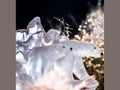 Two frosted glass polar bear sculptures by Daum amidst crystalline ice formations.