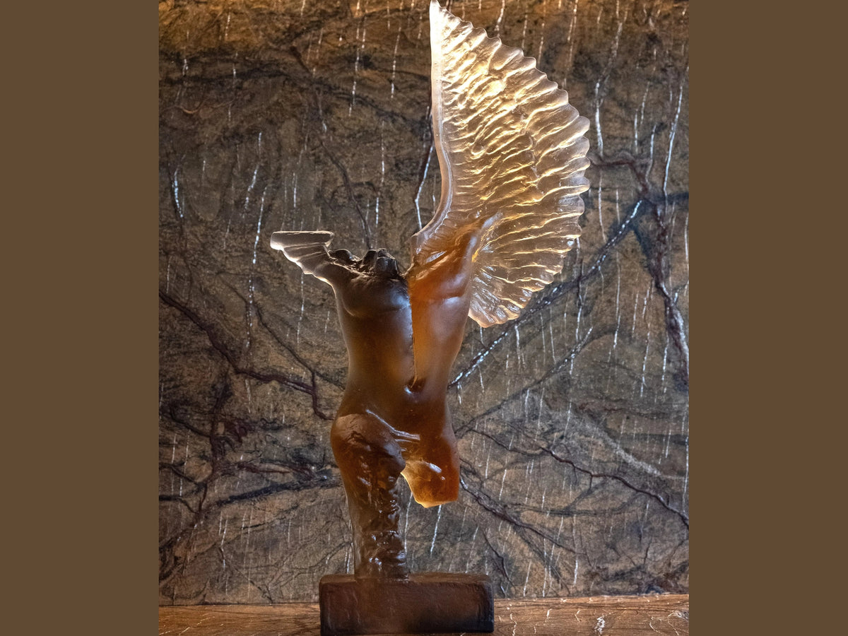 Daum Céyx glass sculpture by Dominique Vial featuring a winged figure on a base