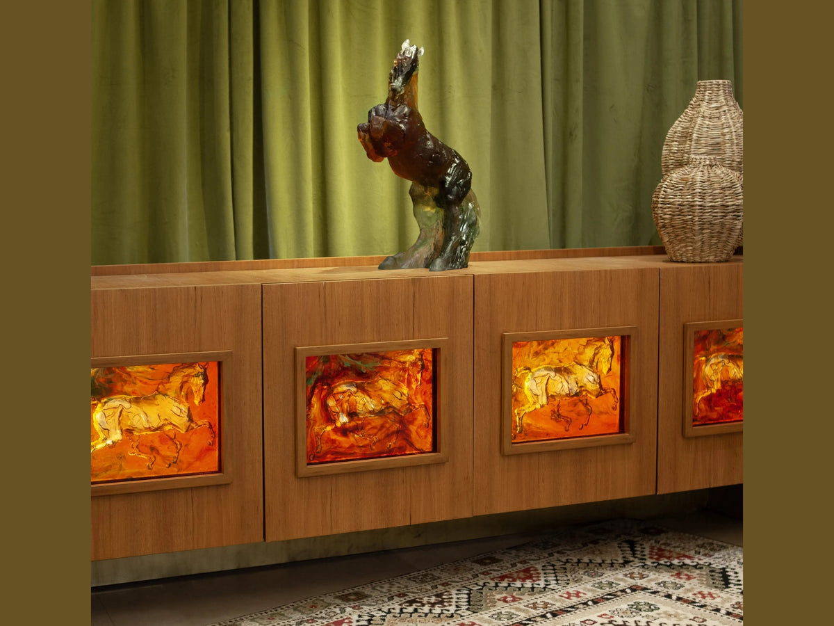 Daum Calypso horse sculpture on a wooden cabinet with illuminated horse art panels