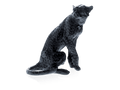 Daum Cheetah Sitting Black sculpture by Jean-François Leroy against a green background