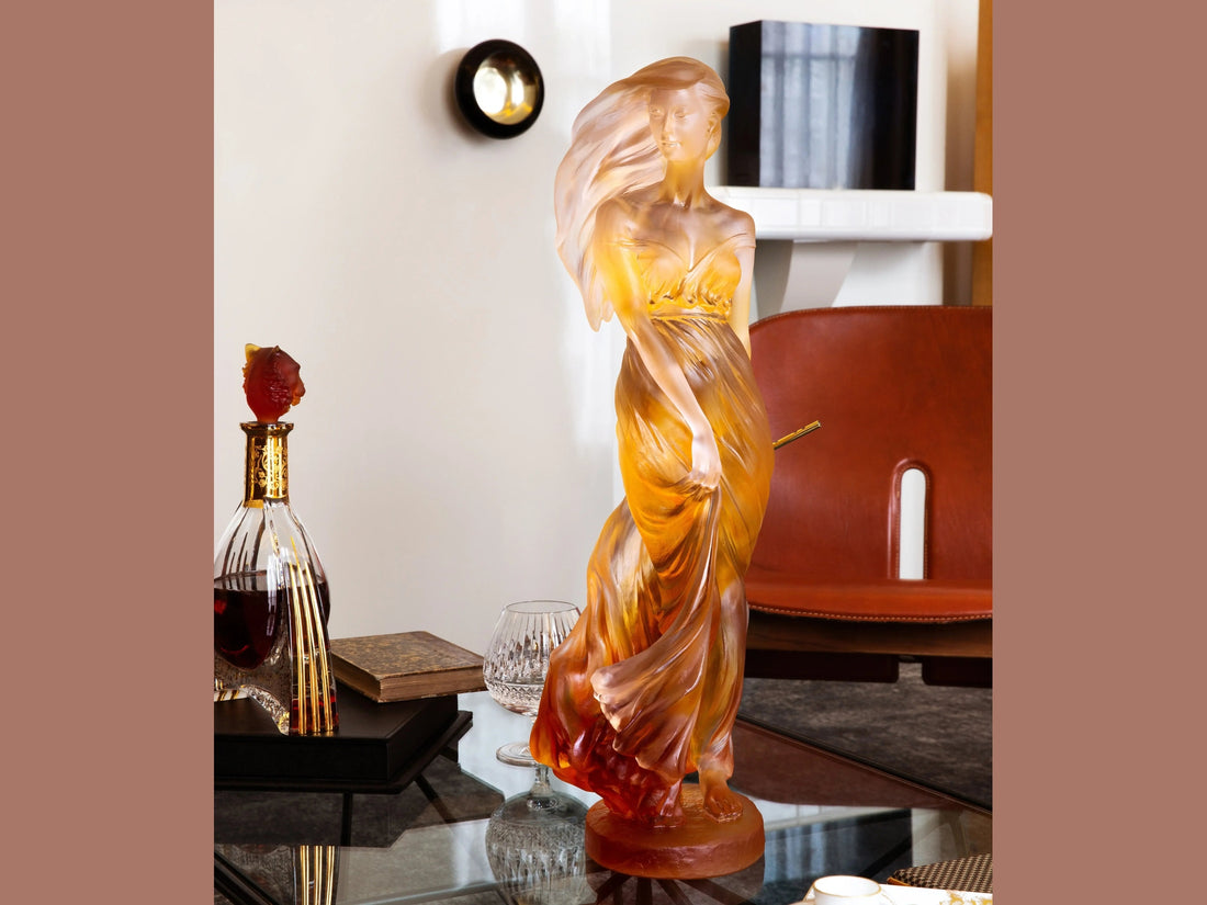 Daum glass sculpture of a nude muse figure in amber and clear tones