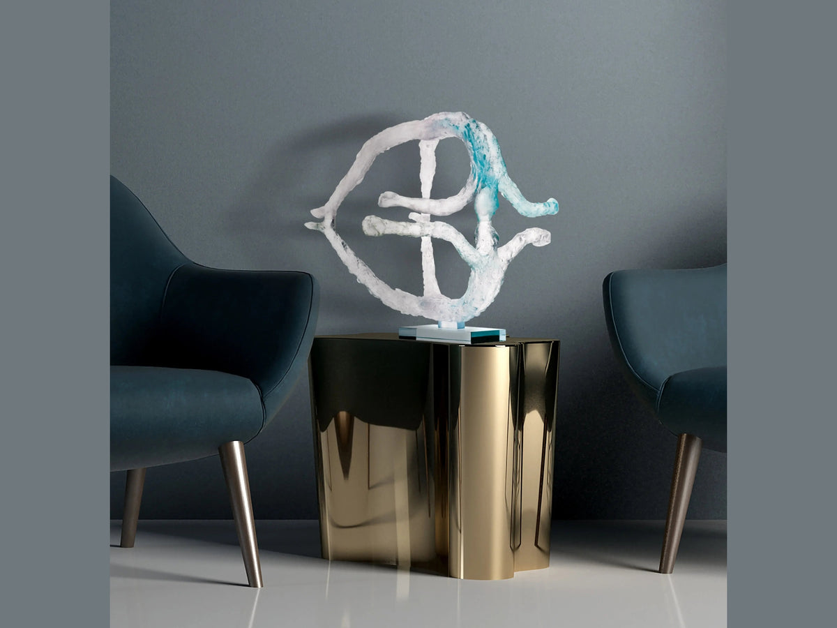 Daum La terre de Louis Derbré abstract glass sculpture on a gold side table