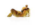 Daum Lune de miel glass sculpture of two embracing figures in amber and gold tones.