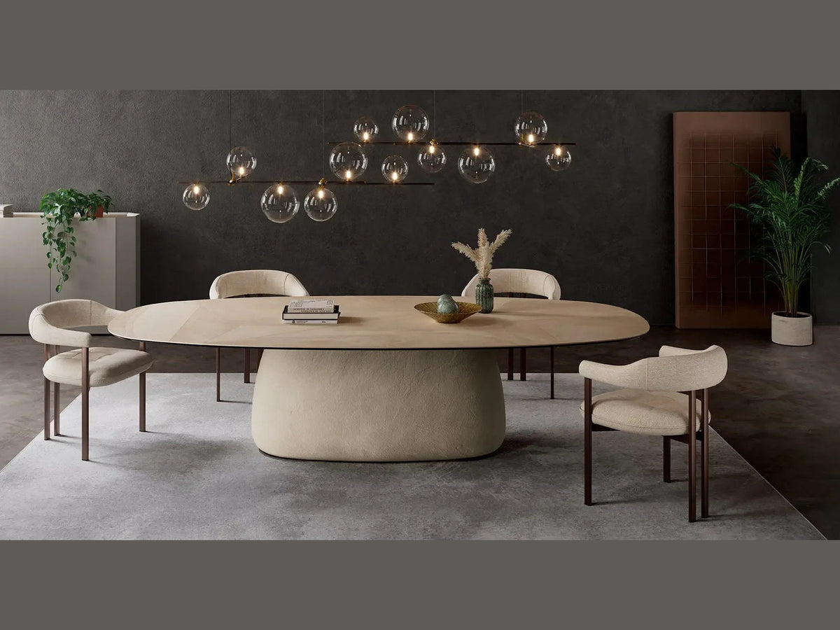 Cattelan Italia BOTERO Keramik oval dining table with cream pedestal and modern chairs.