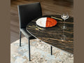 Cattelan Italia BOTERO Keramik oval dining table with dark marble finish and black chair.