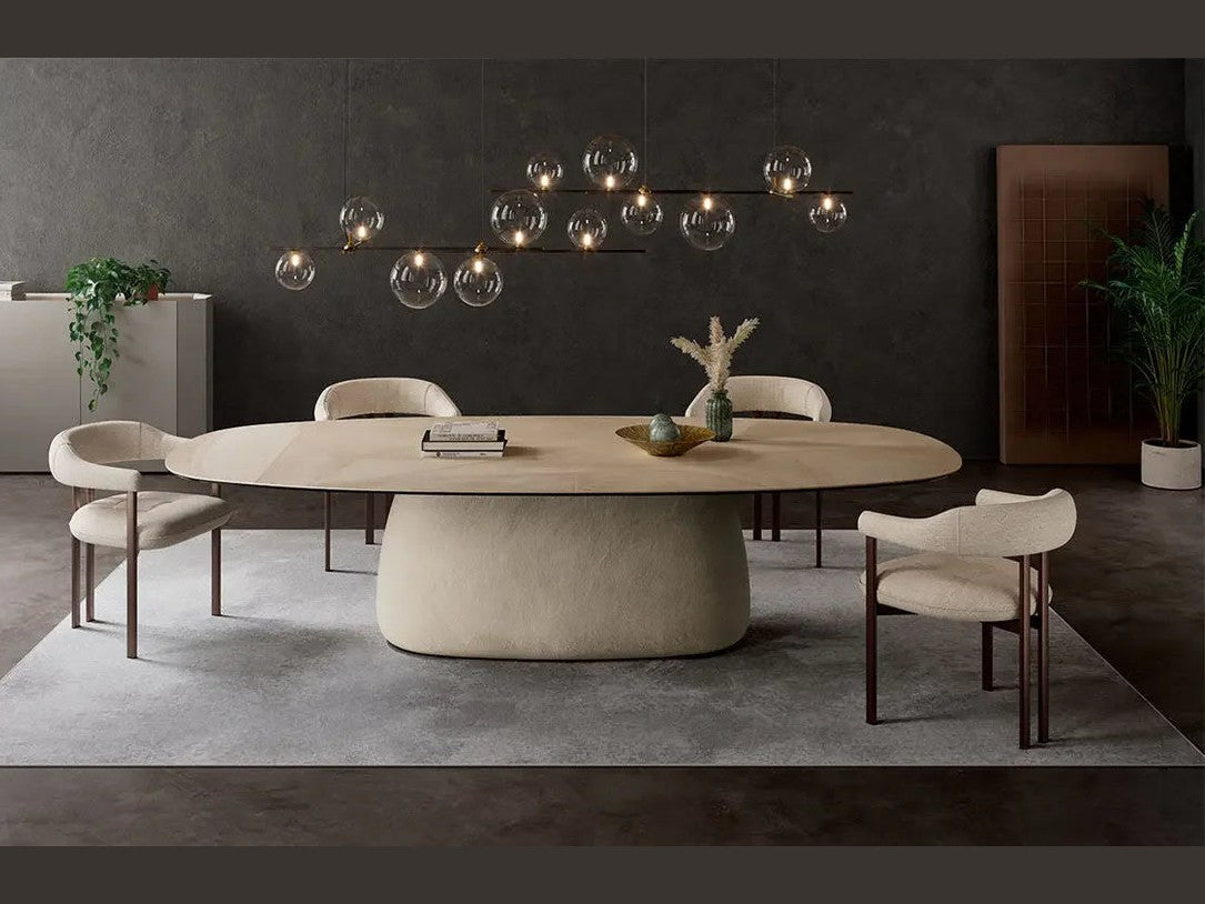 Cattelan Italia BOTERO Keramik oval dining table with cream chairs in a modern dining room.