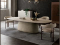 Cattelan Italia BOTERO Keramik oval dining table with cream pedestal base and matching chairs.