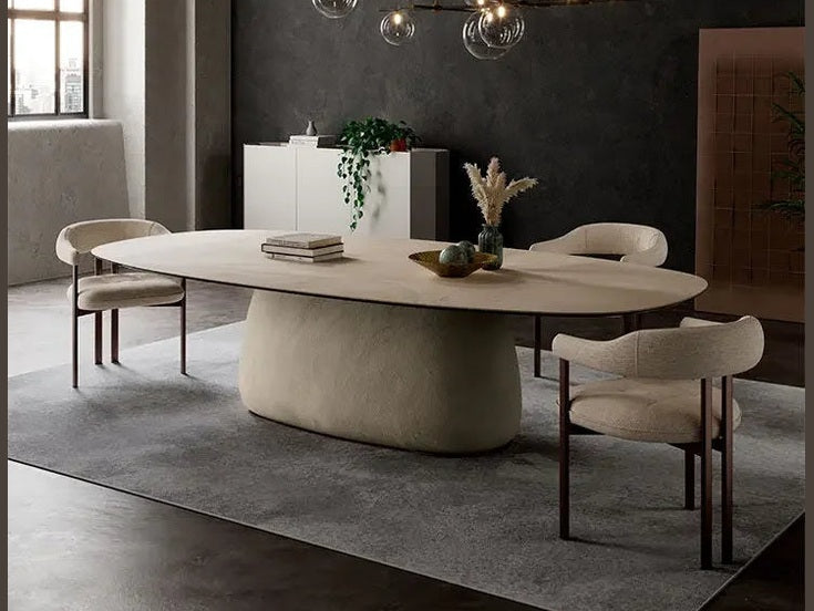 Cattelan Italia BOTERO Keramik oval dining table with cream pedestal base and matching chairs.