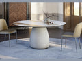 Cattelan Italia BOTERO Keramik Round marble dining table with beige chairs in a modern interior.