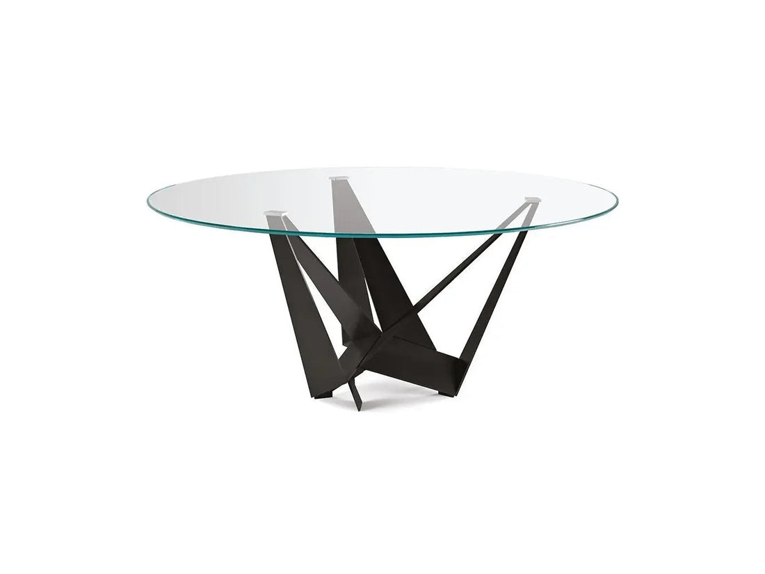 Cattelan Italia SKORPIO Round glass dining table with modern sculptural base and white chairs.