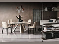 Cattelan Italia ELIOT Keramik Round dining table with marble top and cream upholstered chairs.