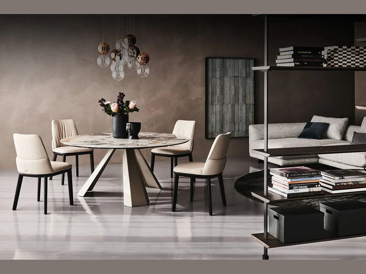 Cattelan Italia ELIOT Keramik Round dining table with marble top and cream upholstered chairs.