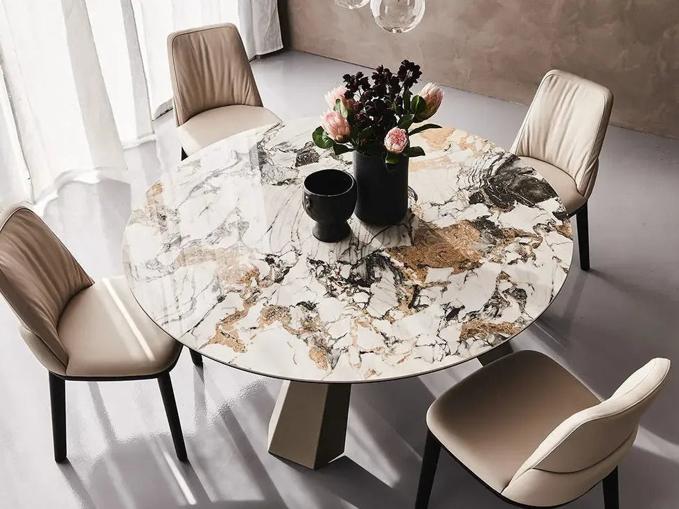 Cattelan Italia ELIOT Keramik Round marble dining table with beige chairs and floral centerpiece