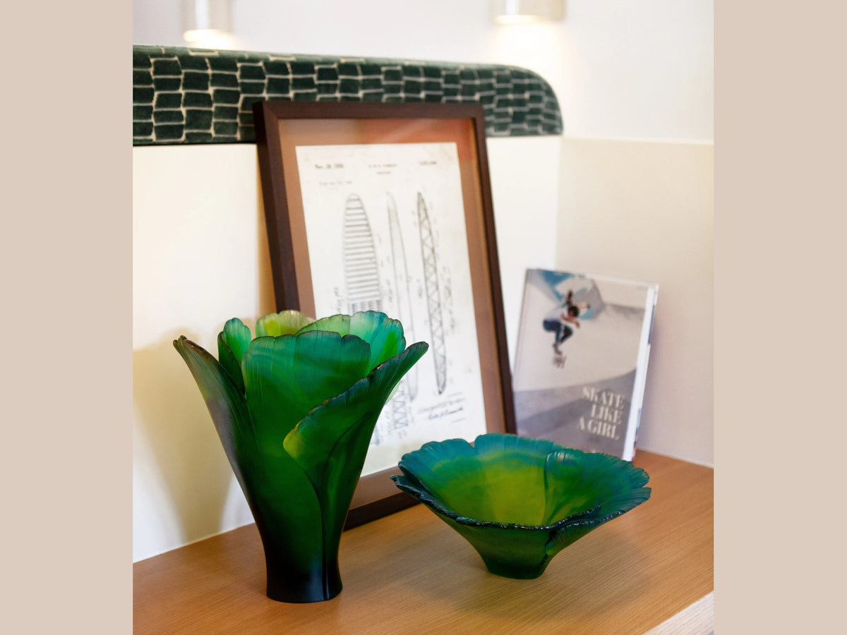 Daum Ginkgo Coupe Haute Verte green glass decorative bowls on a wooden surface.