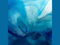 Abstract blue and turquoise swirling patterns of the Daum Maya Coupelle glass art.