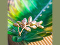 Daum Palm Beach leaf-shaped glass bowl with gold-toned organic fruit accents.