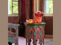 Daum Safran Coupe glass art pieces displayed on an ornate patterned pedestal table.