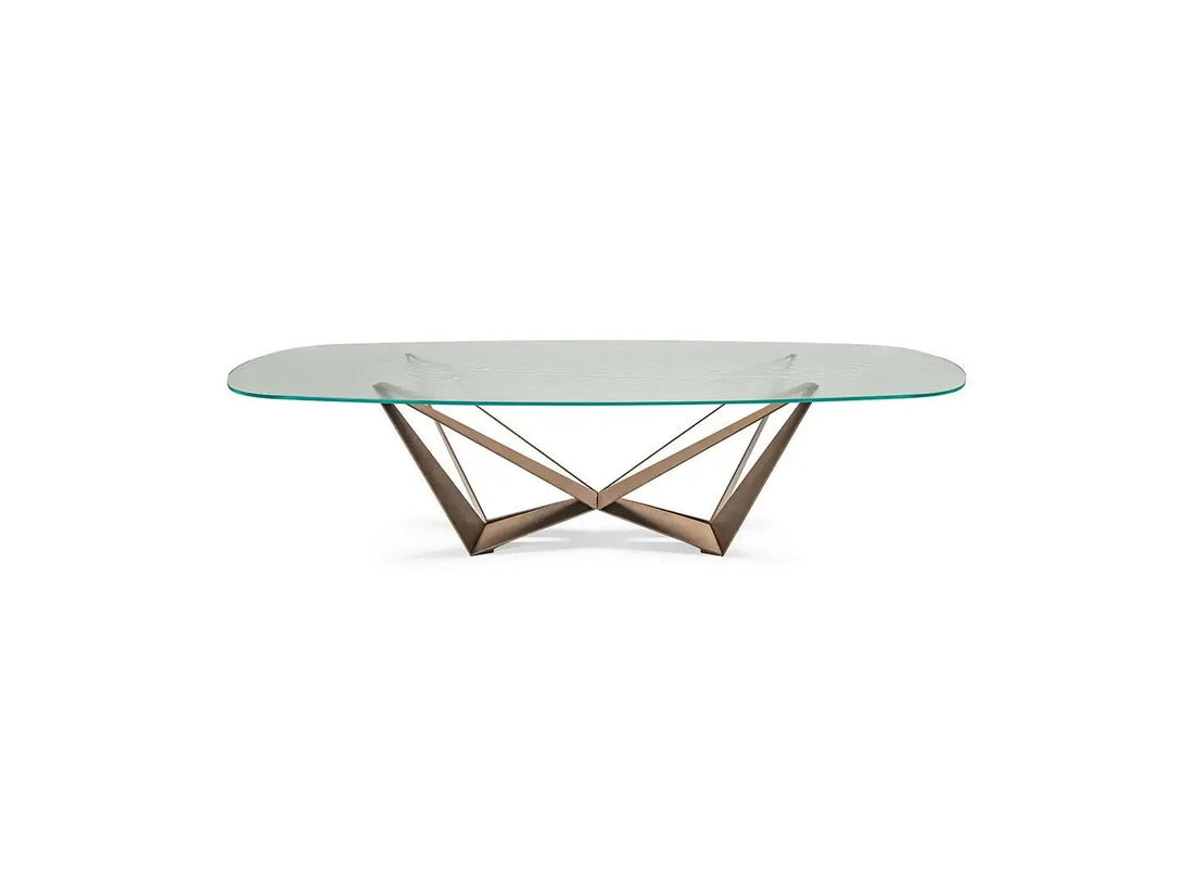 Skorpio Design dining table by Cattelan Italia with glass top and modern chairs.
