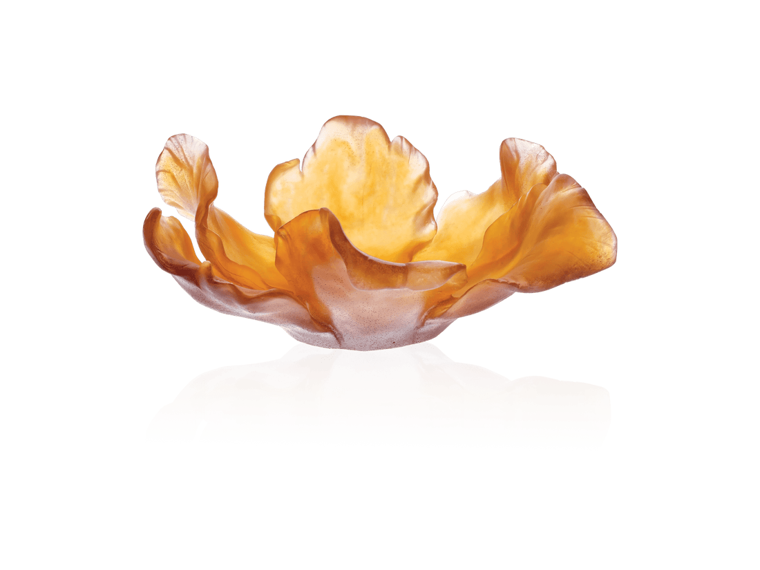 Daum Tulipe Coupe Ambre amber glass bowl with organic petal shapes on a green background