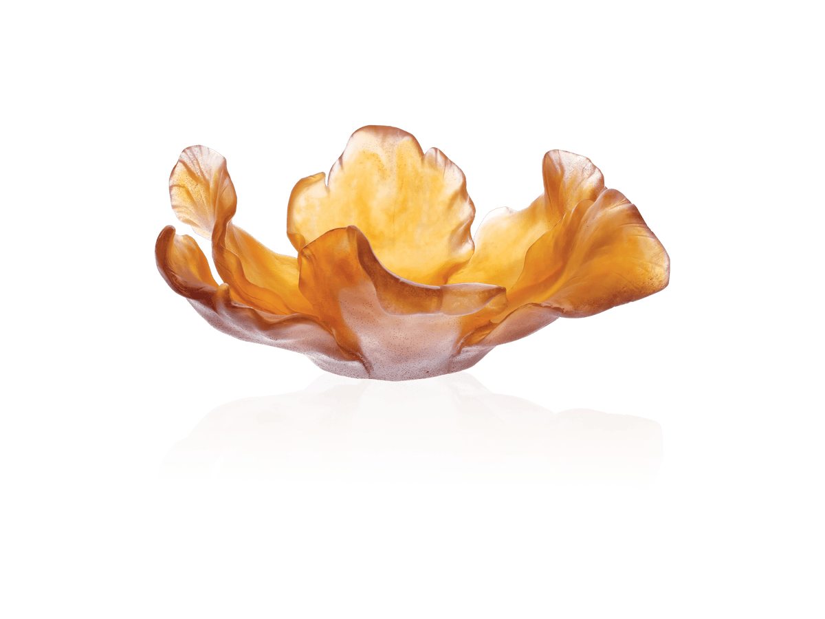 Daum Tulipe Coupe Ambre amber glass bowl with organic petal shapes on a green background