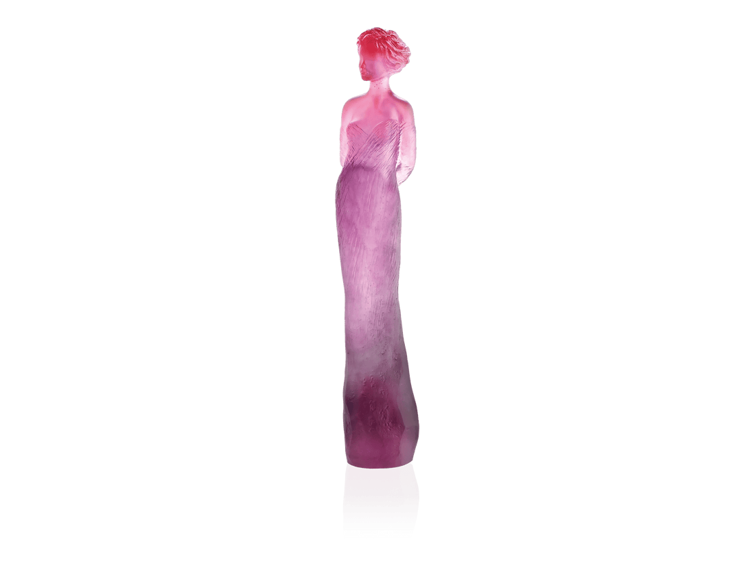 Daum Margot sculpture in red and purple gradient glass against a green background