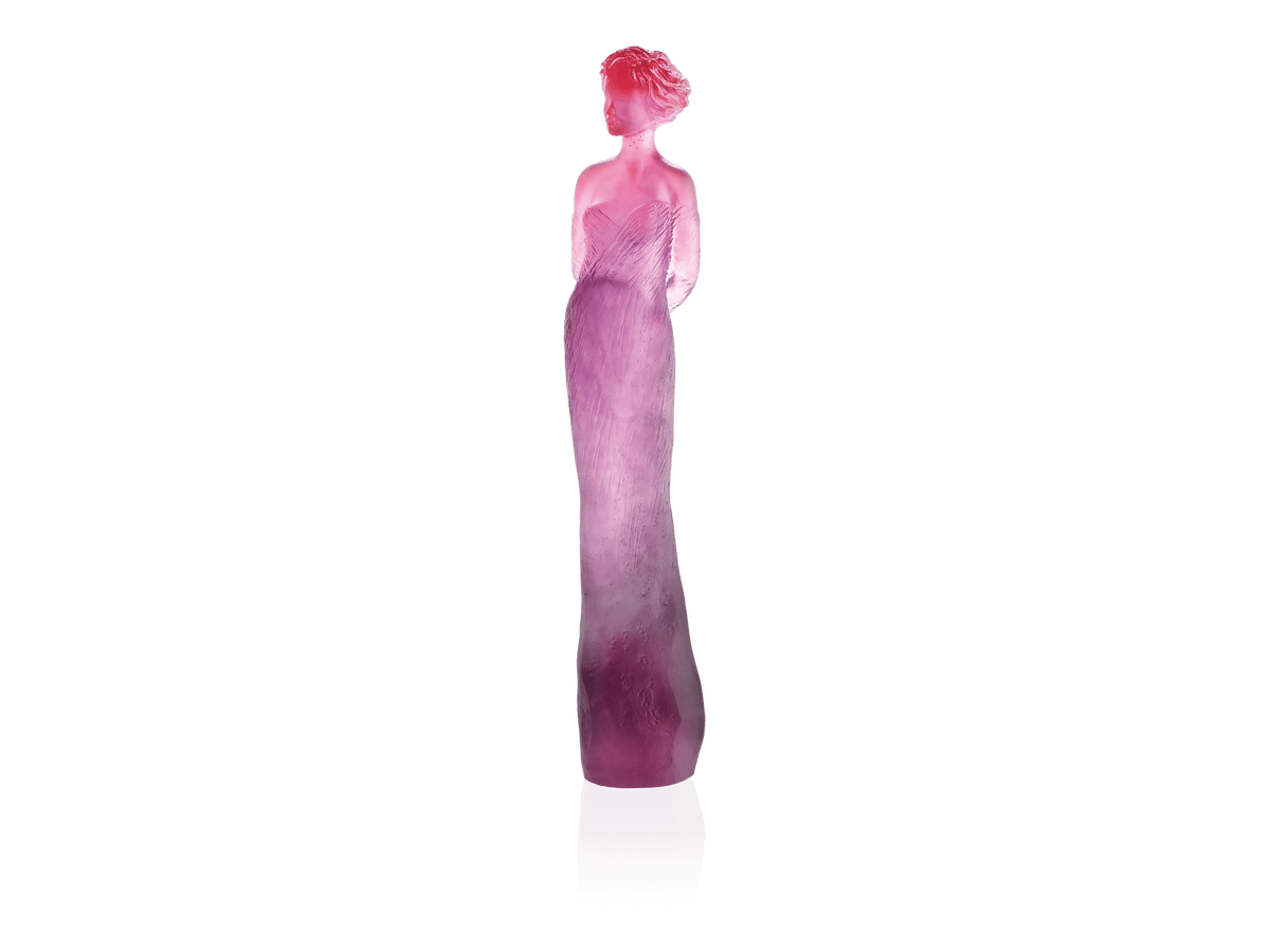 Daum Margot sculpture in red and purple gradient glass against a green background