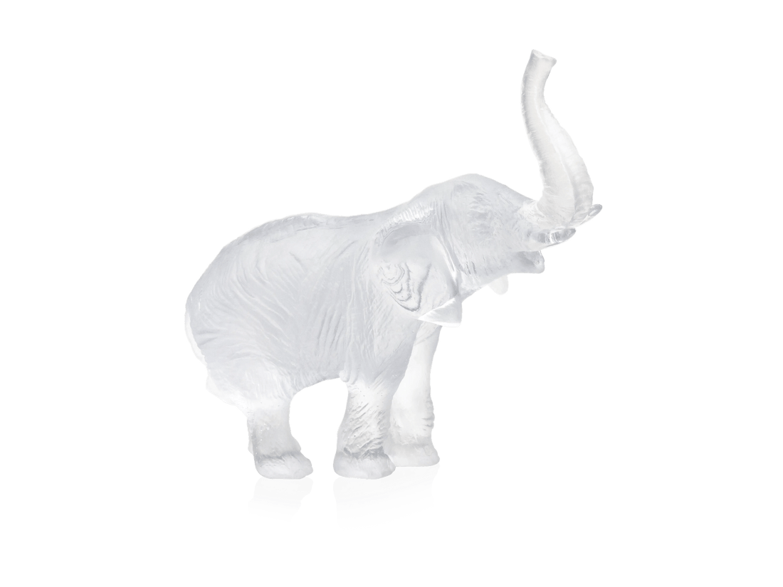 Daum clear glass elephant figurine by Jean-François Leroy with raised trunk.