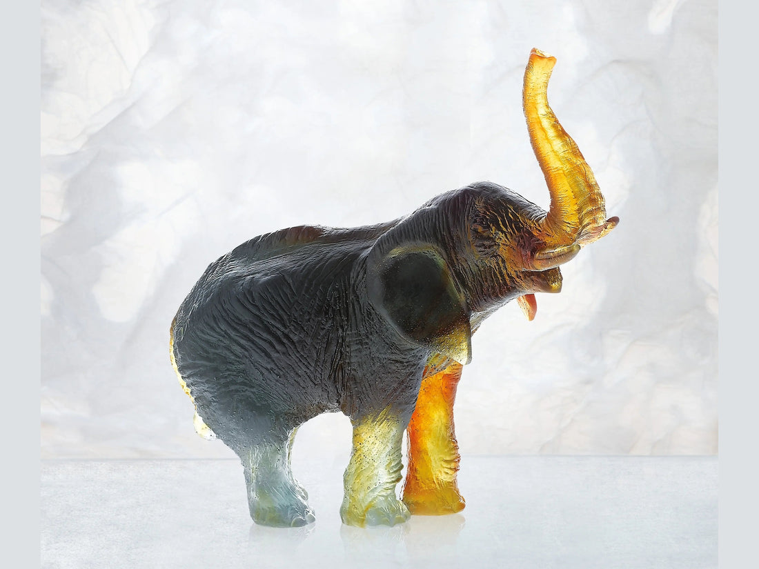 Daum medium elephant model in green and amber glass by Jean-François Leroy