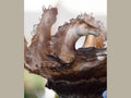 Close-up of Daum Cavalcade centerpiece featuring iced brown glass horse sculptures.