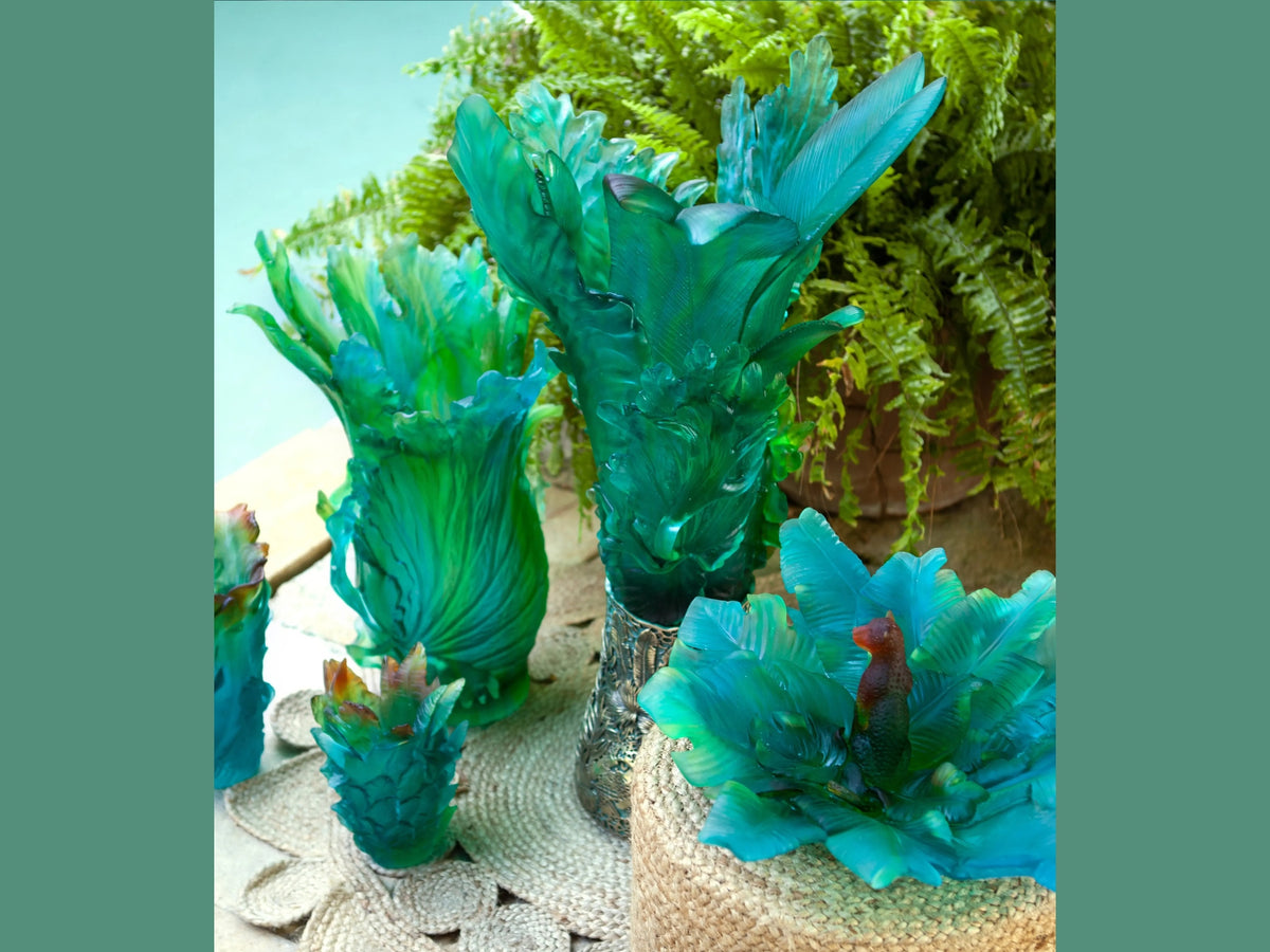 Daum turquoise glass tropical leaf centerpieces in a botanical setting