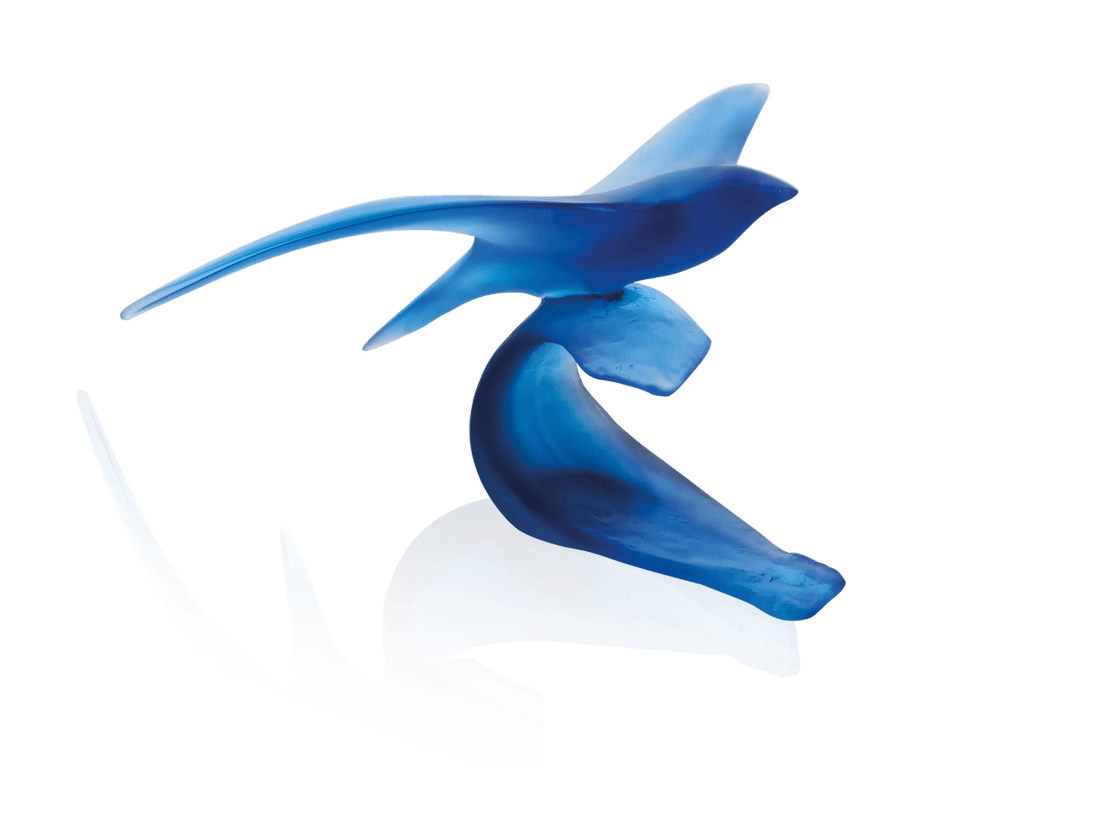 Blue Daum Oiseau Marin glass sculpture by Xavier Carnoy on a black background.