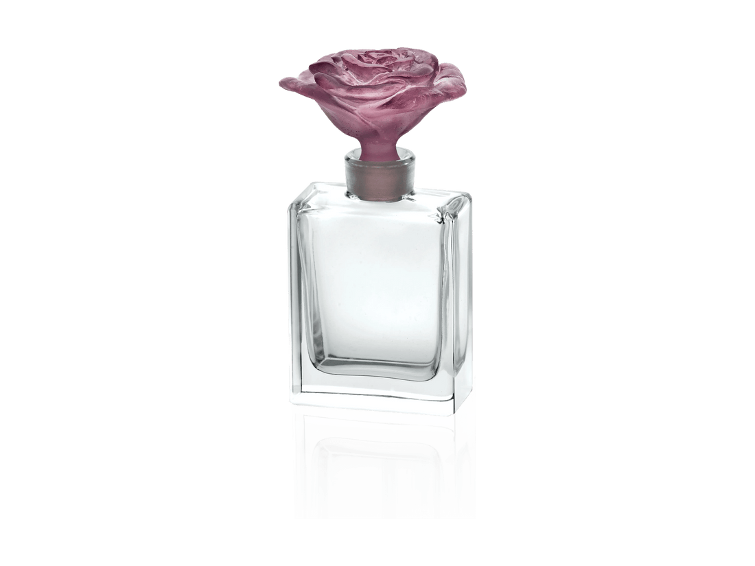 Daum Rose Passion perfume bottle with a pink rose-shaped stopper.