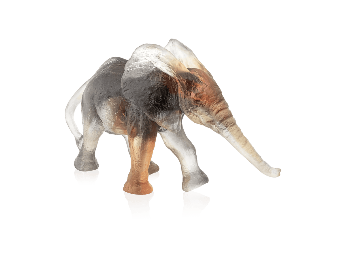 Daum Savannah Elephant glass sculpture by Isabelle Carabantes in amber and smoky tones.