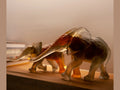 Daum Savannah Elephant glass sculpture by Isabelle Carabantes in warm amber tones.