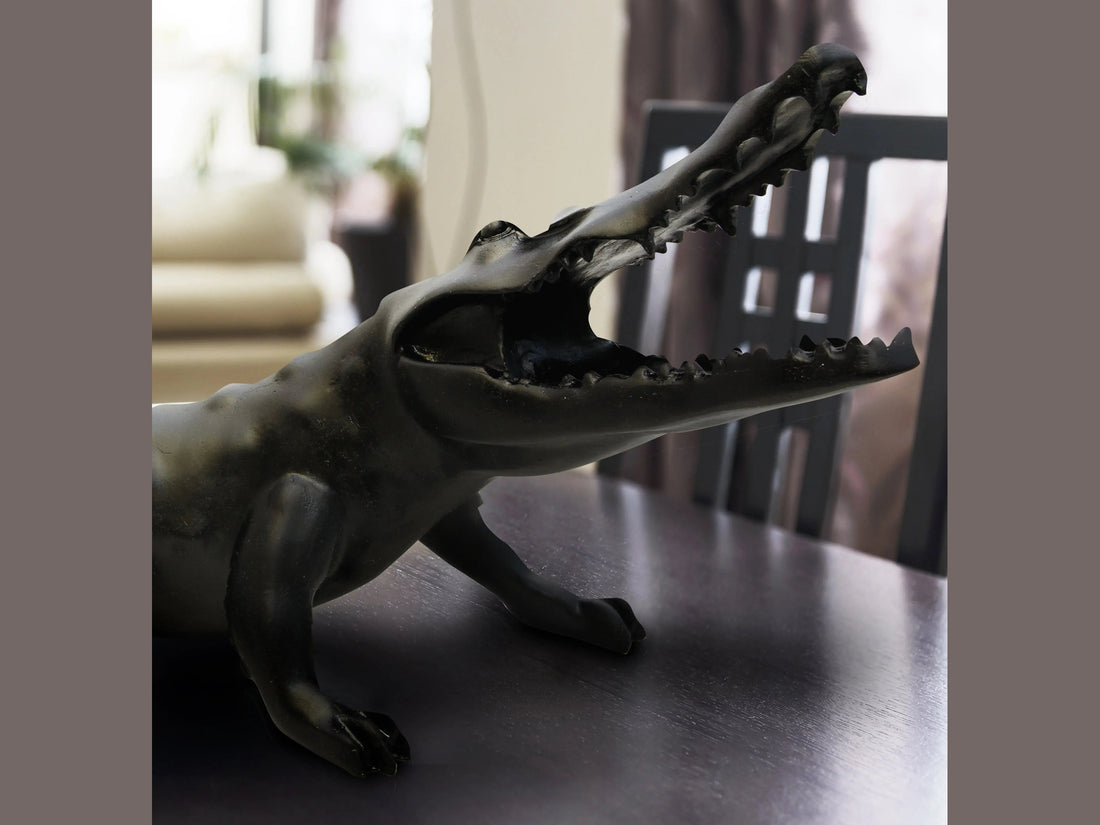 Wild Crocodile Noir sculpture by Daum, featuring a sleek black glossy finish and open jaws.