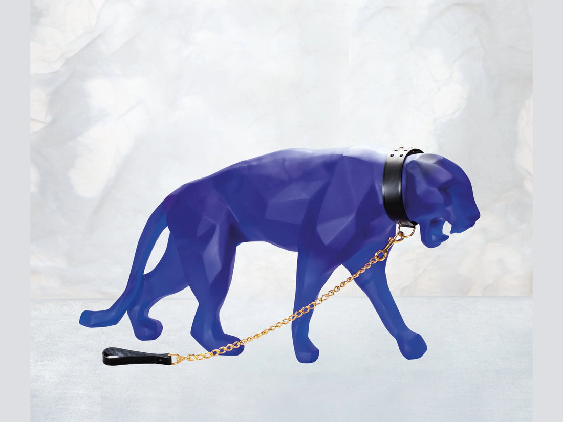 Blue Wild Panther sculpture by Daum with a black collar and gold chain leash
