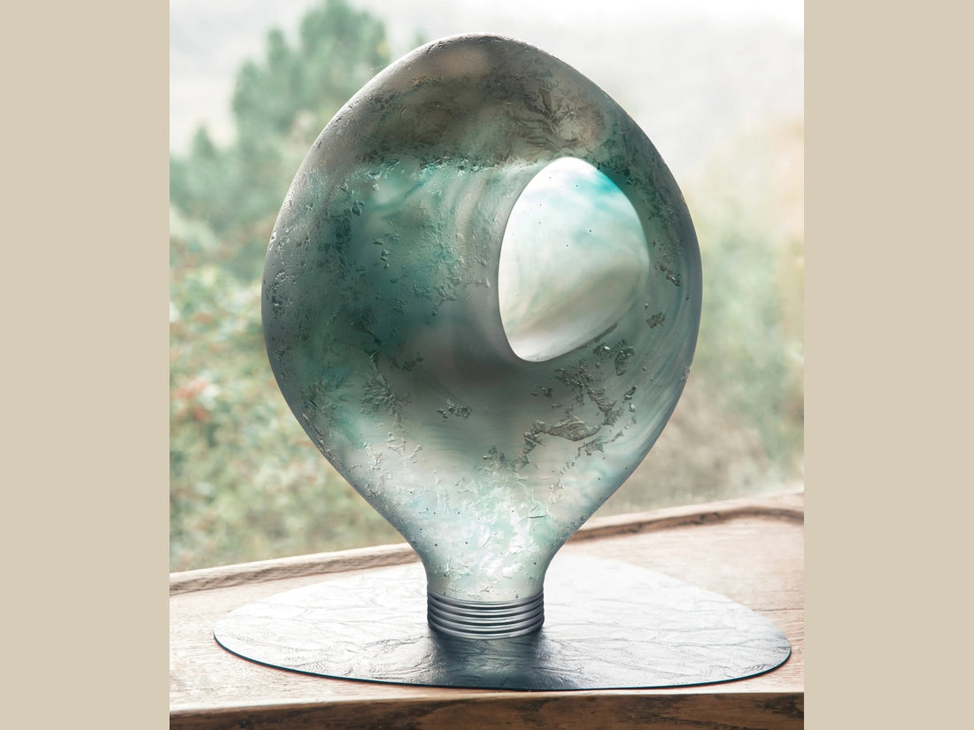 Daum Yeelen azur glass sculpture shaped like a light bulb with swirling blue and silver tones